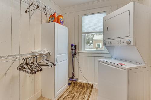 a kitchen with a white refrigerator next to a window at 3 Mi to Downtown Youngstown Updated Apartment in Youngstown