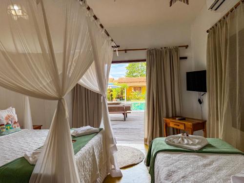 Postel nebo postele na pokoji v ubytování Pousada Casa Sítio Delícia do Quadrado