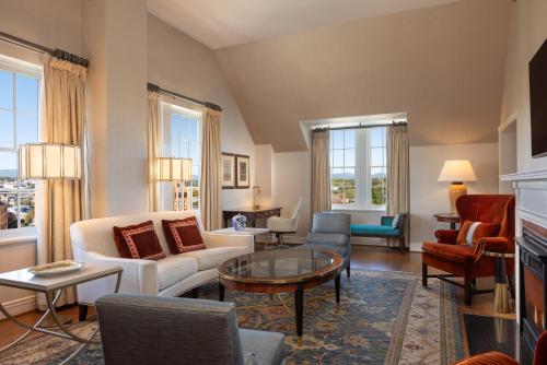 a living room with a couch and chairs and a table at Hotel Roanoke & Conference Center, Curio Collection by Hilton in Roanoke