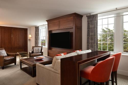 a living room with a couch and a table at Hotel Roanoke & Conference Center, Curio Collection by Hilton in Roanoke