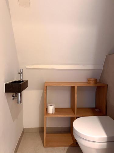 a bathroom with a toilet and a sink at New V Luxury Apartment in Amsterdam