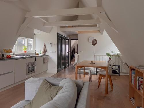 a living room with a couch and a table at New V in Amsterdam