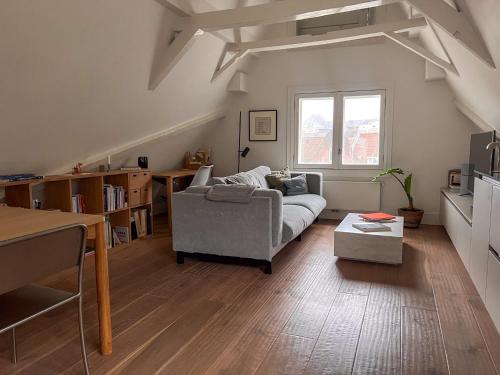 a living room with a couch and a table at New V Luxury Apartment in Amsterdam