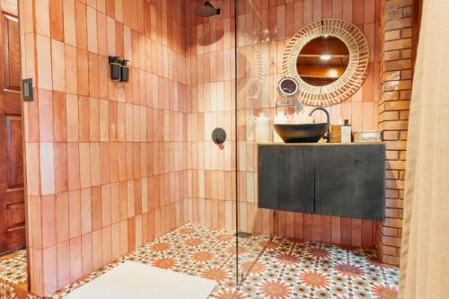 a bathroom with a sink and a shower at awā San José in San José