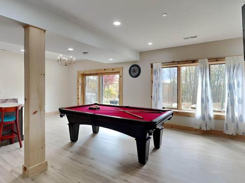 a living room with a pool table in it at Majestic Manor in McHenry