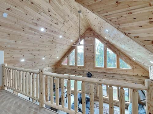 a log cabin with a wooden ceiling at Majestic Manor in McHenry