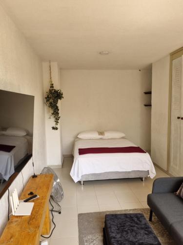 Postel nebo postele na pokoji v ubytování Apartaestudios Zona Norte Vipasa Cali
