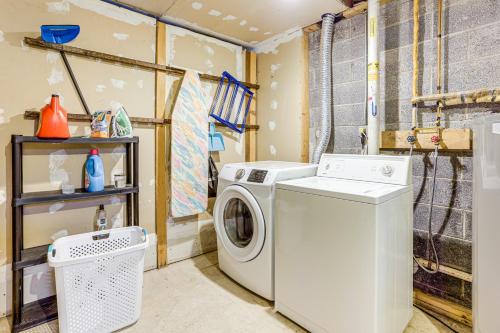 a laundry room with a washing machine in it at Walk to Roaming Woods Lake Home with Fire Pit! in Hamlin