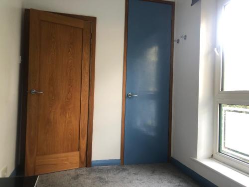 an empty room with a door and a window at Bassett Home - Single Room And Free Parking in Southampton