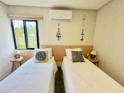 Villa Sapê 13客房内的一张或多张床位