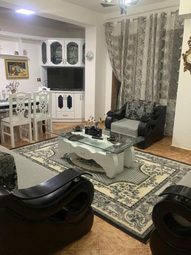 a living room with a couch and a table at Fabio's Apartament in Pogradec