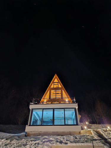 a house with a pointed roof on top of it at A villa in Marija Trošt