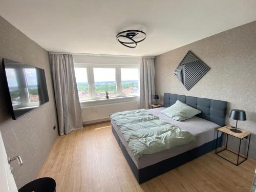 a bedroom with a bed and a window at Apartment Weitblick in Braunschweig