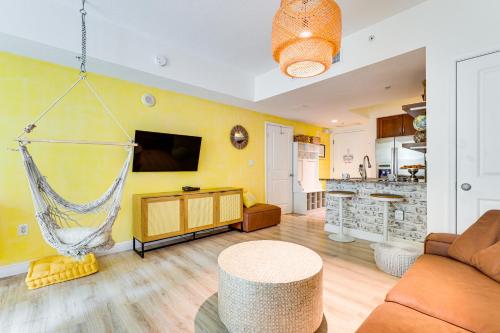 a living room with a hammock hanging from a wall at Resort Condo about 1 Mi to Boynton Beach Access! in Boynton Beach