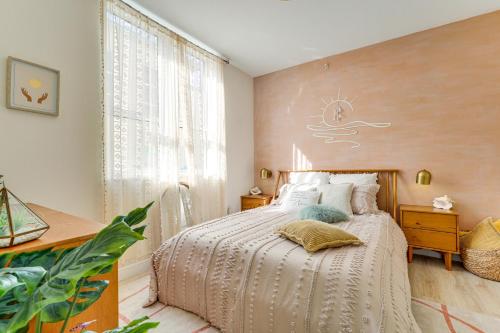 a bedroom with a bed with a white comforter at Resort Condo about 1 Mi to Boynton Beach Access! in Boynton Beach
