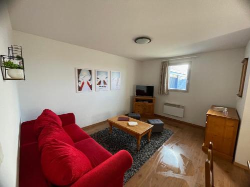 Μια τηλεόραση ή/και κέντρο ψυχαγωγίας στο Grand appartement PEYRA'GOOD tout équipé linge de lit et de toilette inclus - 8 couchages - Station Peyragudes - Vue montagne - 2 balcons-terrasses