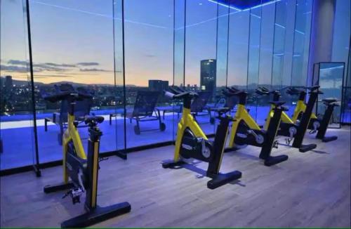a gym with rows of exercise bikes on a building at Colonia Americana Vista Home in Guadalajara