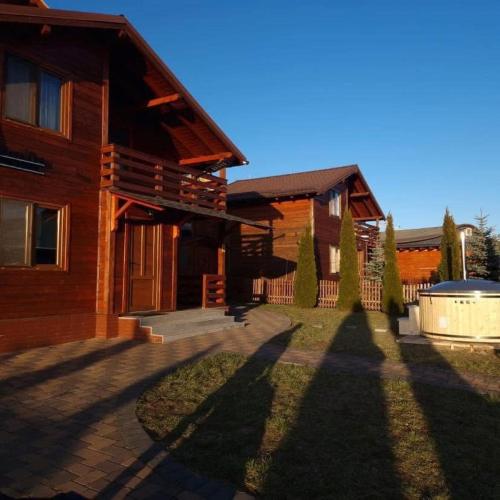 a house with a large yard in front of it at Cabana Irina Băile Figa in Beclean