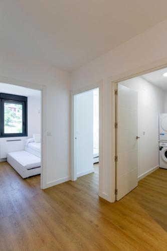 Ένα ή περισσότερα κρεβάτια σε δωμάτιο στο Urbanfive apartamentos Ourense centro