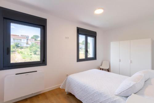 Ένα ή περισσότερα κρεβάτια σε δωμάτιο στο Urbanfive apartamentos Ourense centro
