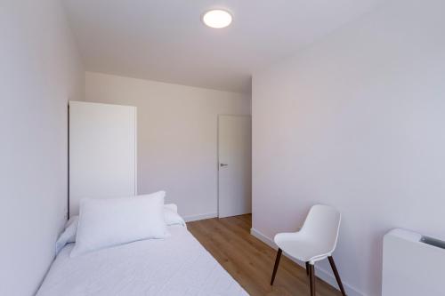 Ένα ή περισσότερα κρεβάτια σε δωμάτιο στο Urbanfive apartamentos Ourense centro