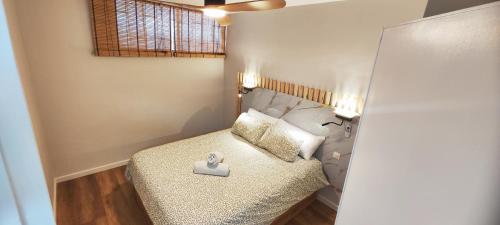 Ένα ή περισσότερα κρεβάτια σε δωμάτιο στο Océano Apartament