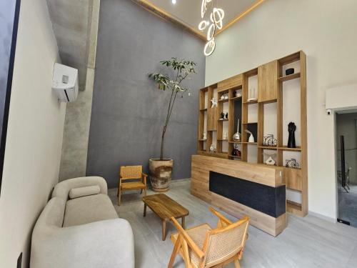 a living room with a couch and a fireplace at Torre Luum by Duna Stays in Guadalajara