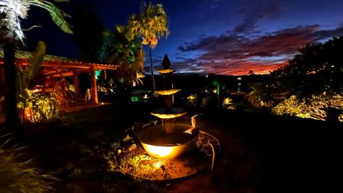 a bath tub in a yard at night at Rancho Recanto da Serra in Delfinópolis