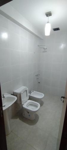 a bathroom with a toilet and a sink at Los Nardos Duplex 3 in San Salvador de Jujuy