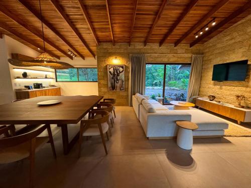 a living room with a couch and a table at Chachagua Rainforest Hotel & Hot Springs in Fortuna