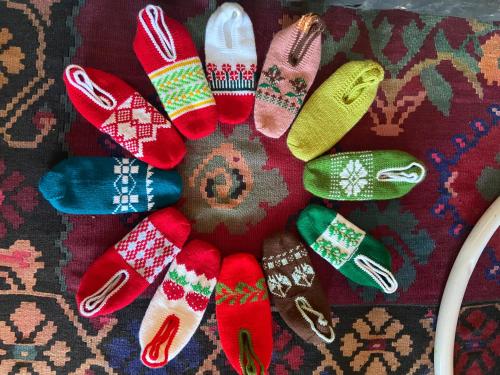 a bunch of pairs of socks arranged in a circle at Konak Umoljani in Umoljani