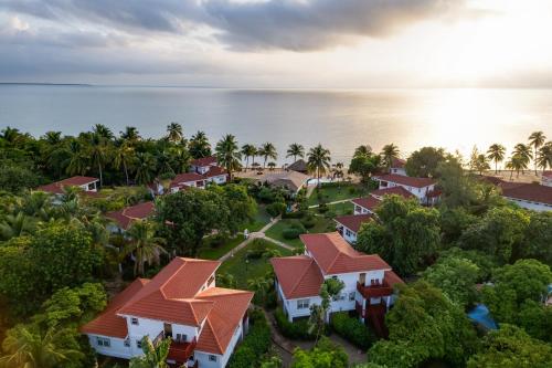 an aerial view of a resort near the ocean at Belizean Dreams Resort in Hopkins