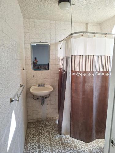 a bathroom with a shower and a sink at Casa Miranda Airport in Mexico City
