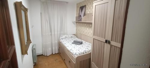 a small room with a bed in a room at Dreams Work - Your refuge in Burgos in Burgos