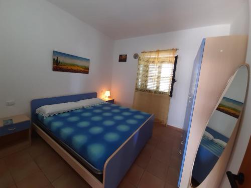 Ένα ή περισσότερα κρεβάτια σε δωμάτιο στο Villa Le Mezzane