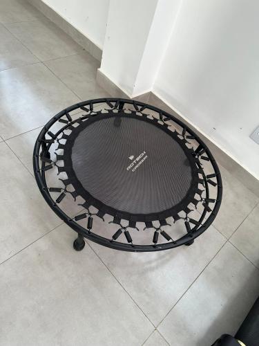 a black metal table sitting on a floor at Concierge House Exclusiva in Marabá