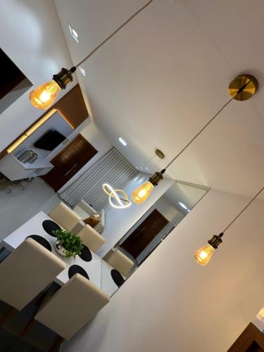 an overhead view of a living room and kitchen with lights at Concierge House Exclusiva in Marabá