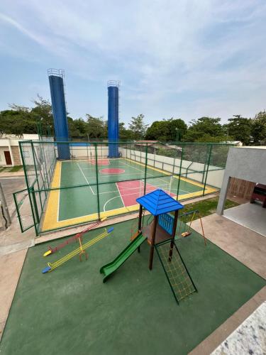 a tennis court with several different types of courts at Concierge House Exclusiva in Marabá