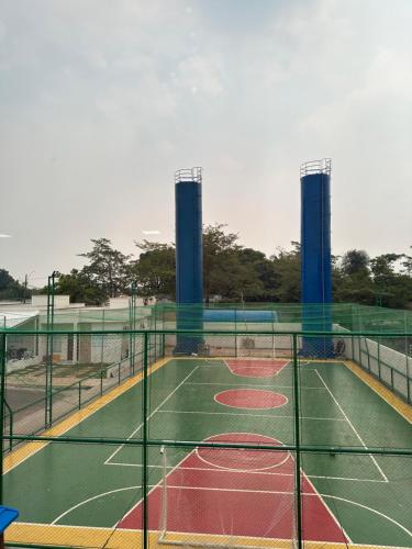 a tennis court with two towers on top of it at Concierge House Exclusiva in Marabá