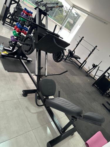 a gym with several exercise equipment in a room at Concierge House Exclusiva in Marabá