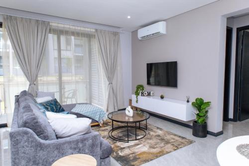 TV a/nebo společenská místnost v ubytování GoshenG2 Apartment