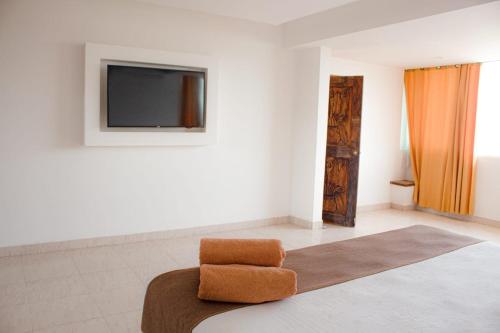 TV a/nebo společenská místnost v ubytování Hotel en Tequesquitengo