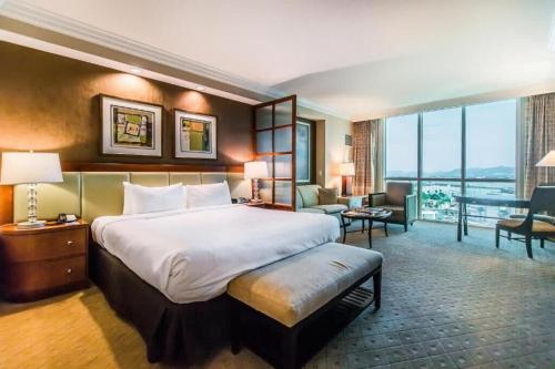 a hotel room with a large bed and a large window at NEW MGM 25818 STUDIO in Las Vegas