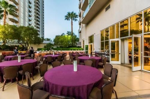 a group of purple tables and chairs in a building at NEW MGM 25818 STUDIO in Las Vegas