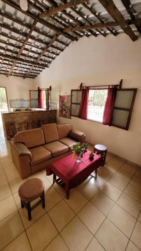 a living room with a couch and a table at Kasa KAÏLO in Kafountine