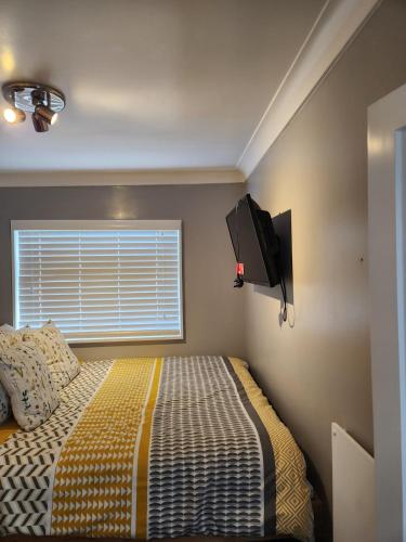 Ένα ή περισσότερα κρεβάτια σε δωμάτιο στο Charming 2-Bed Chalet
