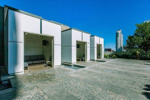 a row of garages on a building at Stylish Palms Mountain View Studio BALCONY ACCESS 28309 in Las Vegas