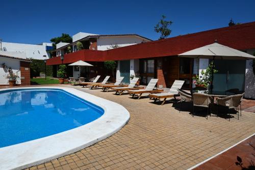 Der Swimmingpool an oder in der Nähe von Hotel Hacienda