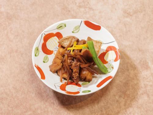 a plate of food on a table at 丘の上から海が見える一棟貸しヴィラ しまいろ長手 in Nagate