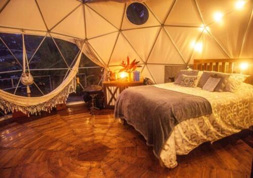 Letto o letti in una camera di Hotel Faith Glamping Dome Costa Rica